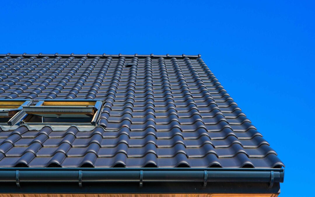 low angle closeup shot black roof - benefits of tile roof restoration